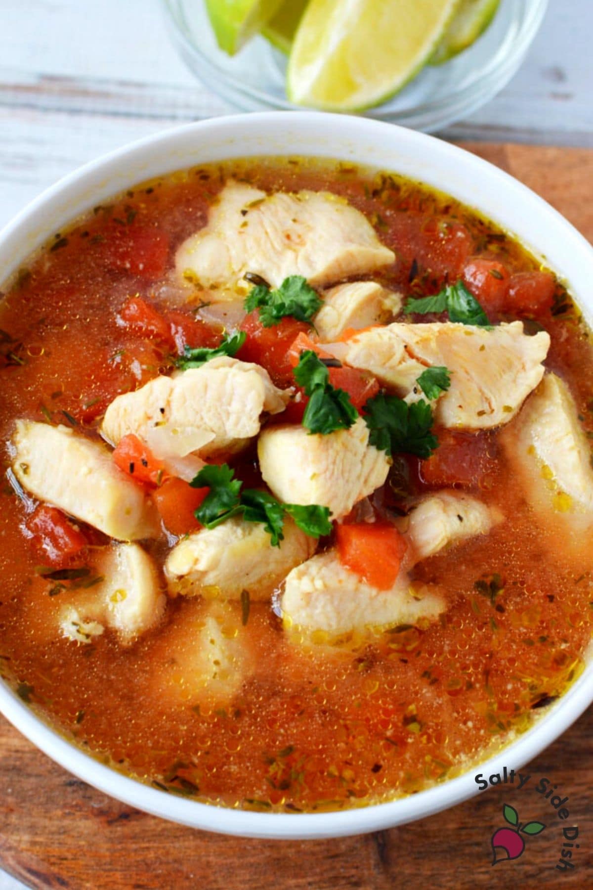 mexican soup with chunks of chicken in a bowl