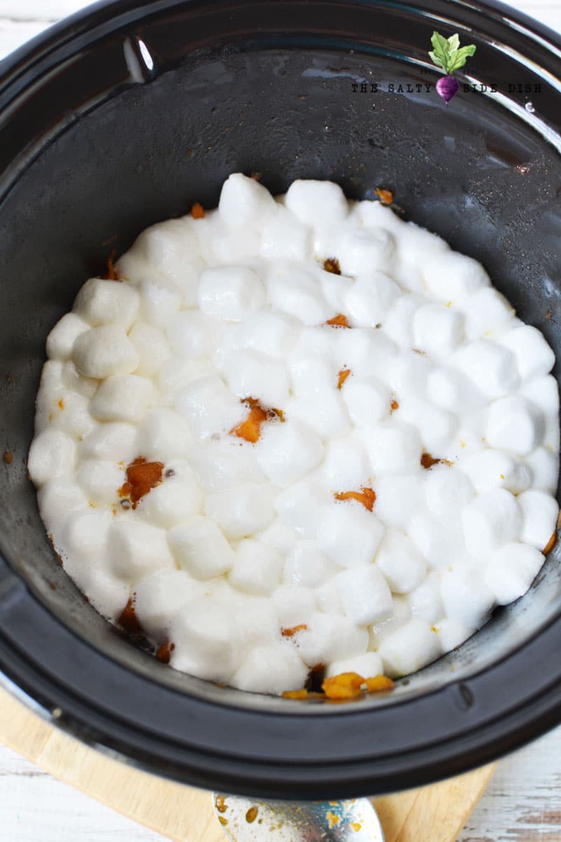 slow cooker marshmallows and pecans with made sweet potatoes ready to serve