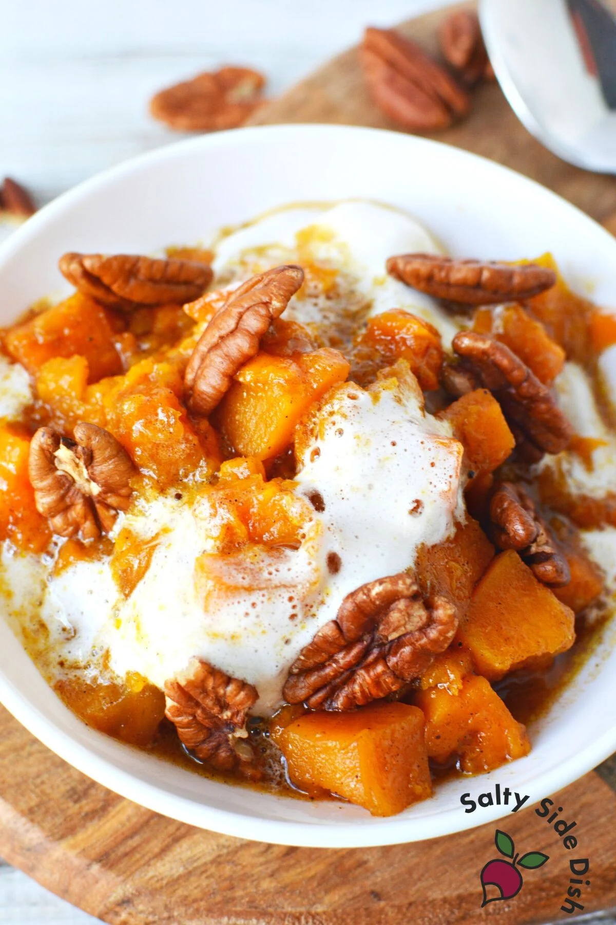 Best Sweet Potato Casserole in Crock Pot smothered in mini marshmallows and pecans.