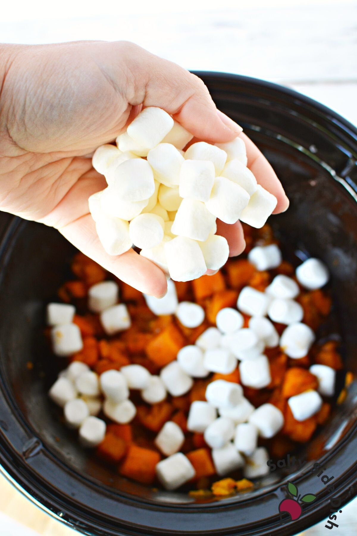 adding marshmallow topping.