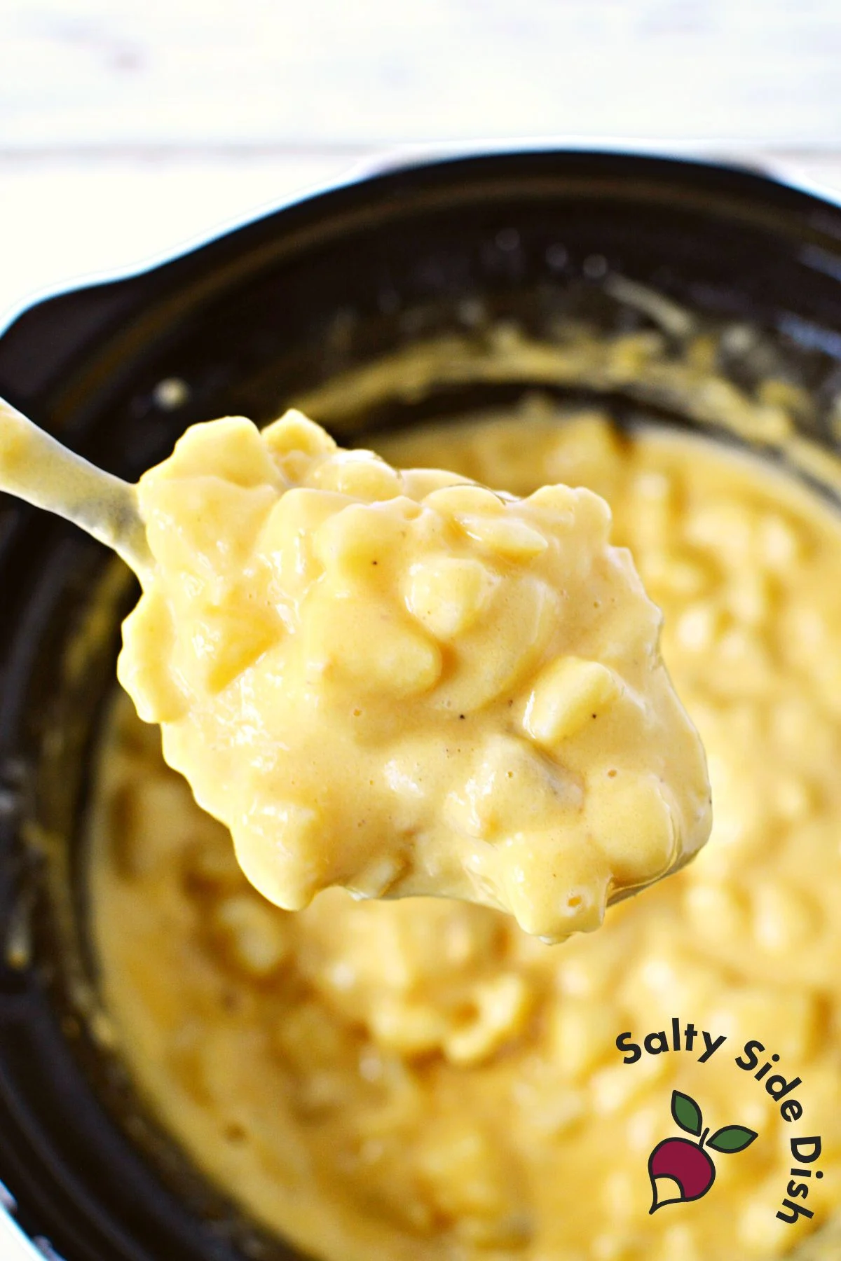 large spoonful of cheesy potatoes.