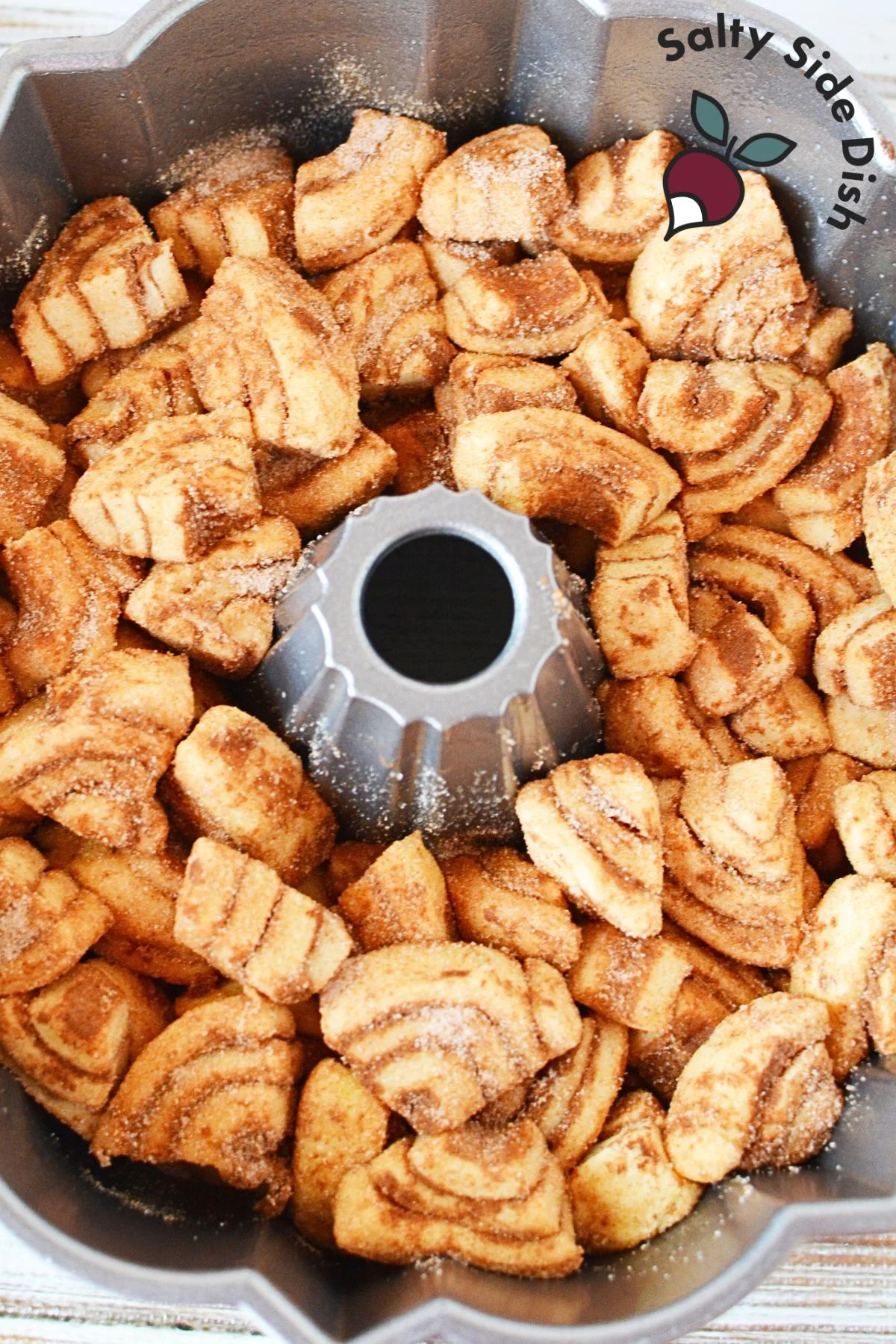 cinnamon rolls layered in Bundt cake pan