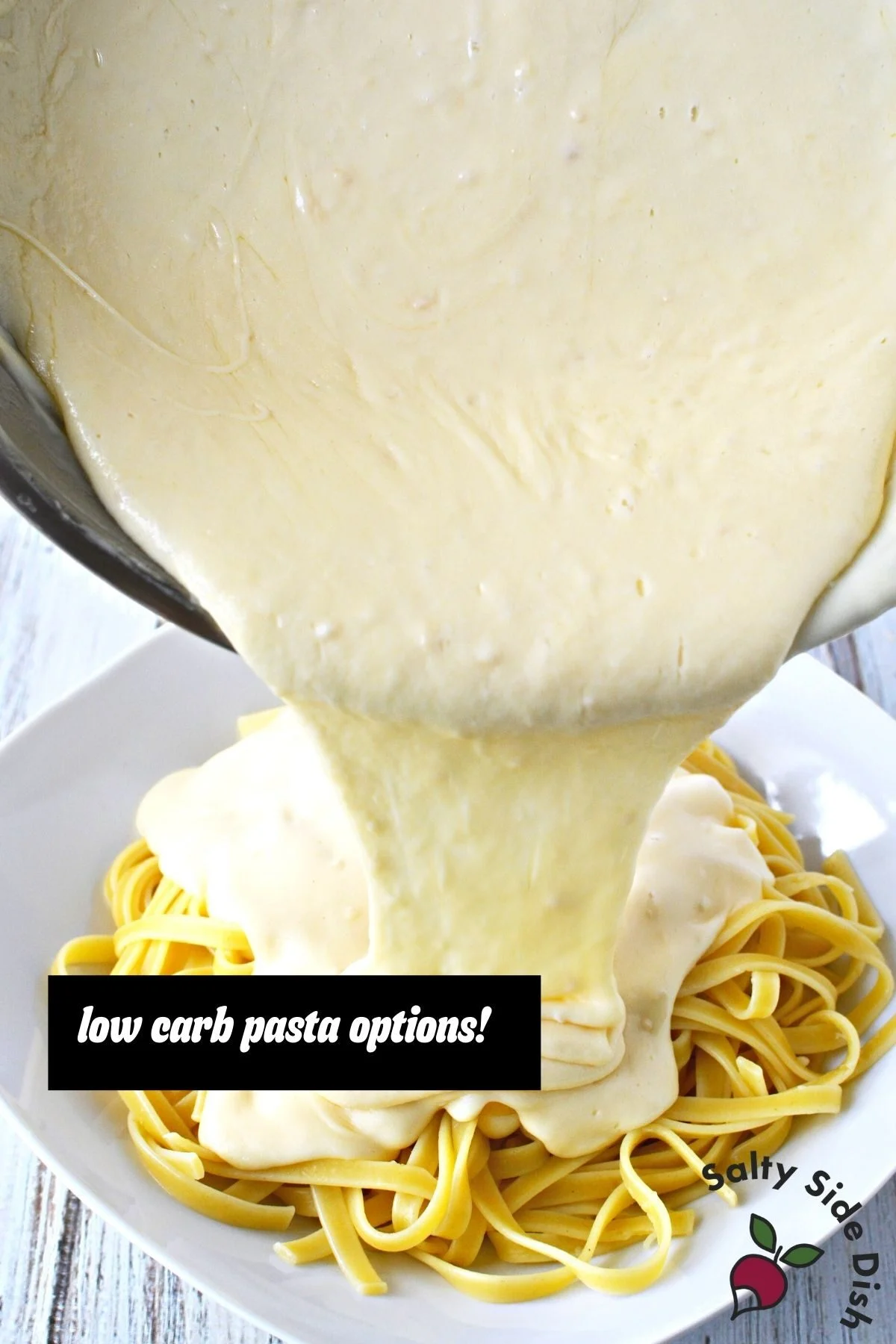 pouring alfredo over low carb pasta.