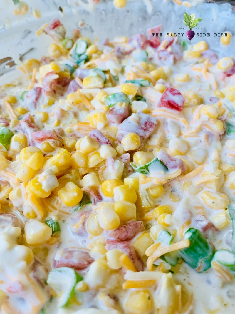 amazing corn dip for a party with fresh kernels of corn in a creamy dipping sauce
