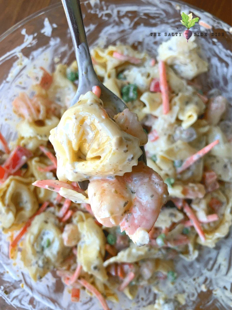 entirely mix your pasta and dressing together to make the perfect pesto pasta salad with shrimp