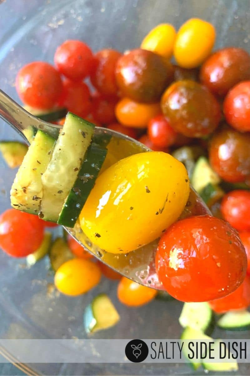 spoonful of tomato salad, cucumber ready to eat