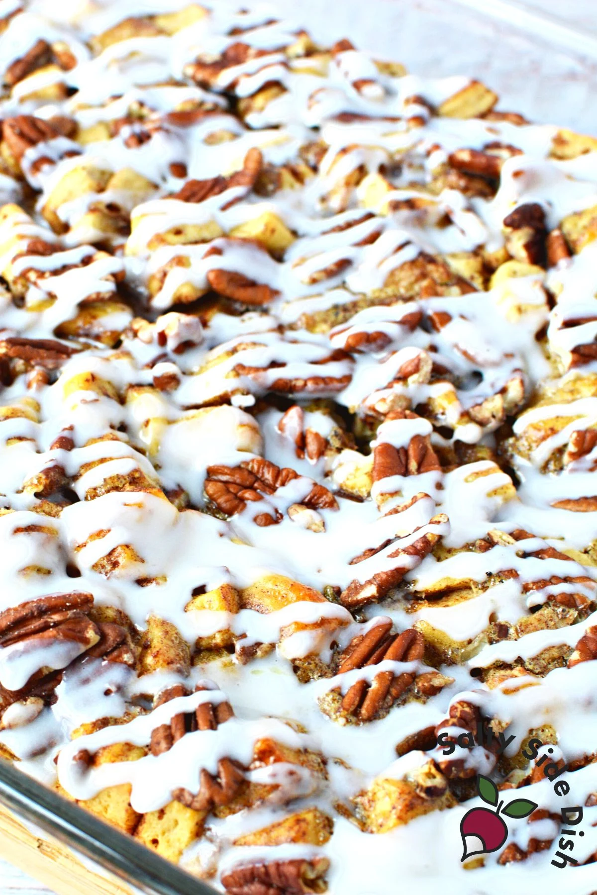 easily the best cinnamon roll casserole with icing and maple syrup.