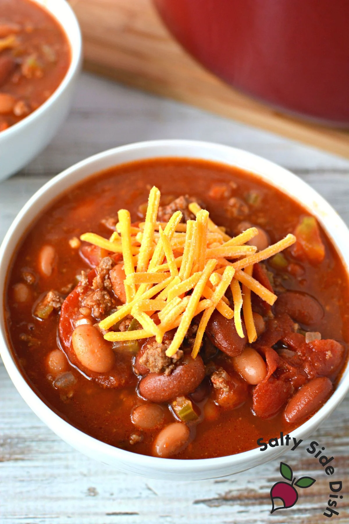 cheese on chili topped in bowl for Wendy's Copycat Chili Recipe