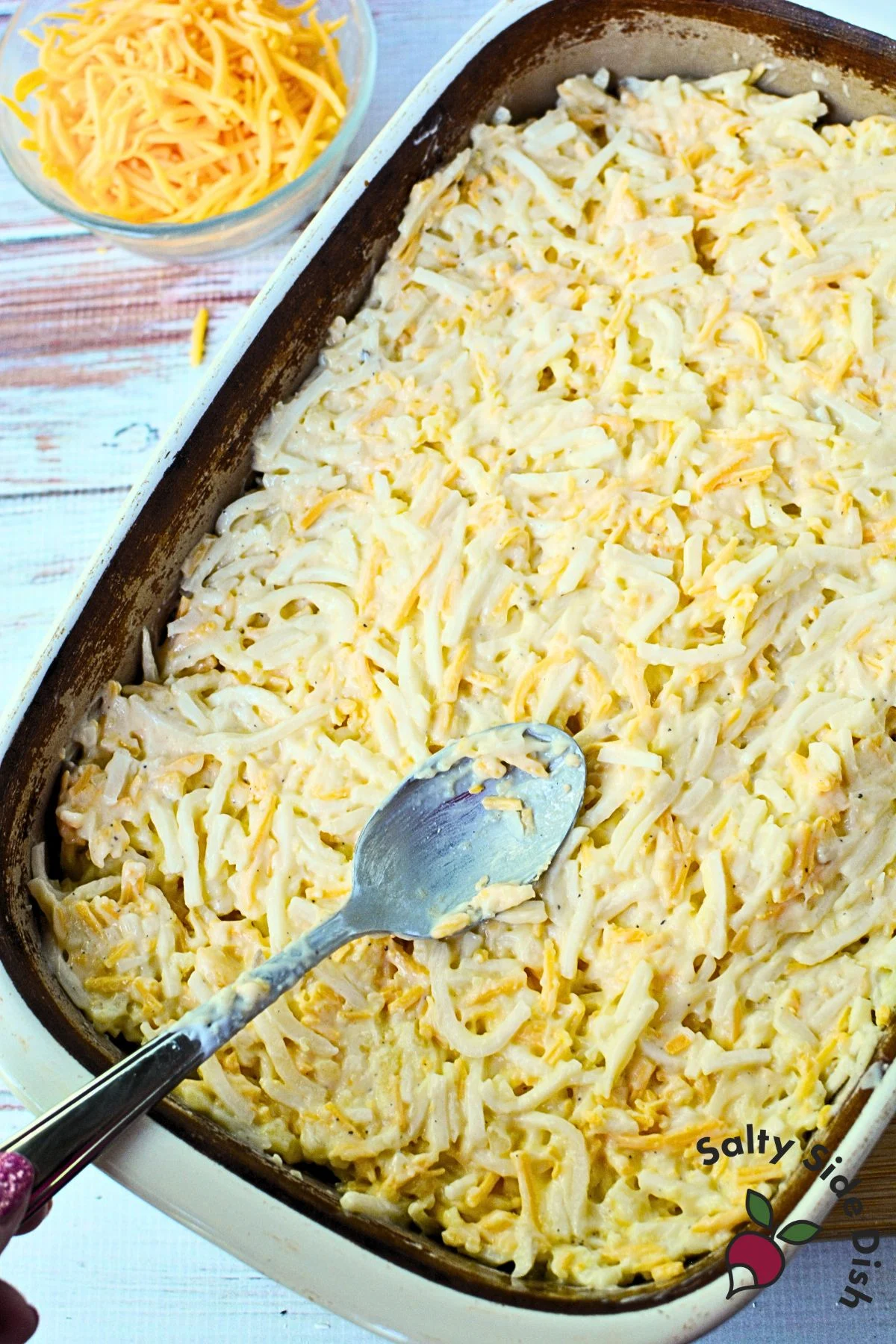 The back of a spoon or spatula helps you smooth out the casserole without smashing it down.