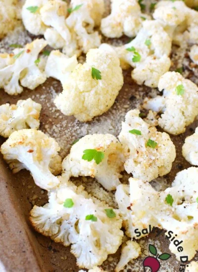 parmesan garlic roasted cauliflower on a sheet pan.