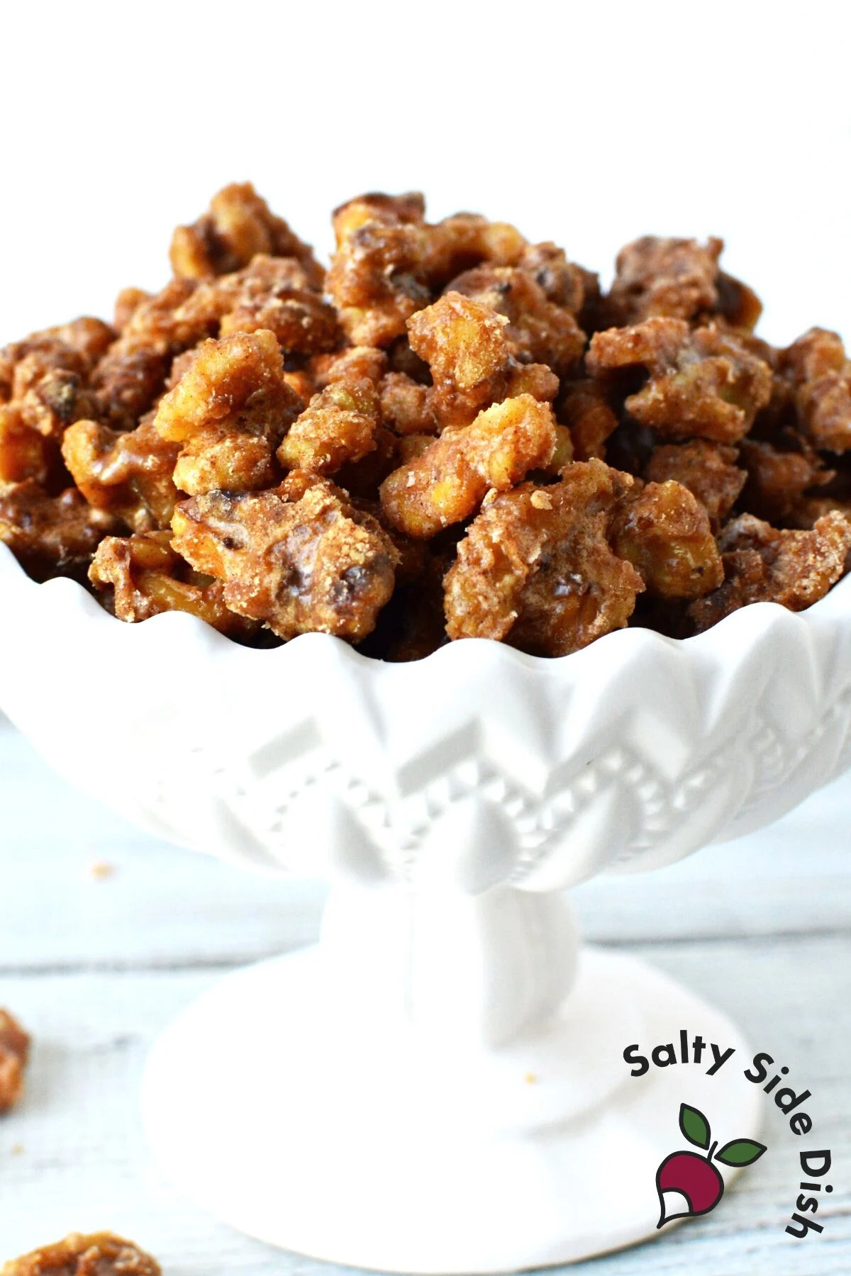 candied walnuts in a white dish.