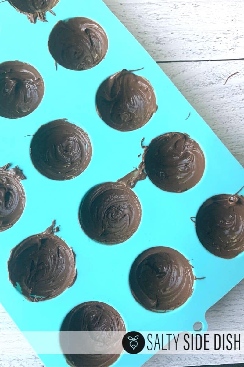 chocolate molds half filled out and ready to harden