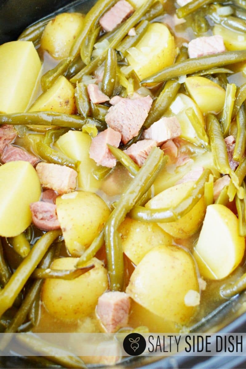 slow cooker green beans, ham, and potatoes in a liquid