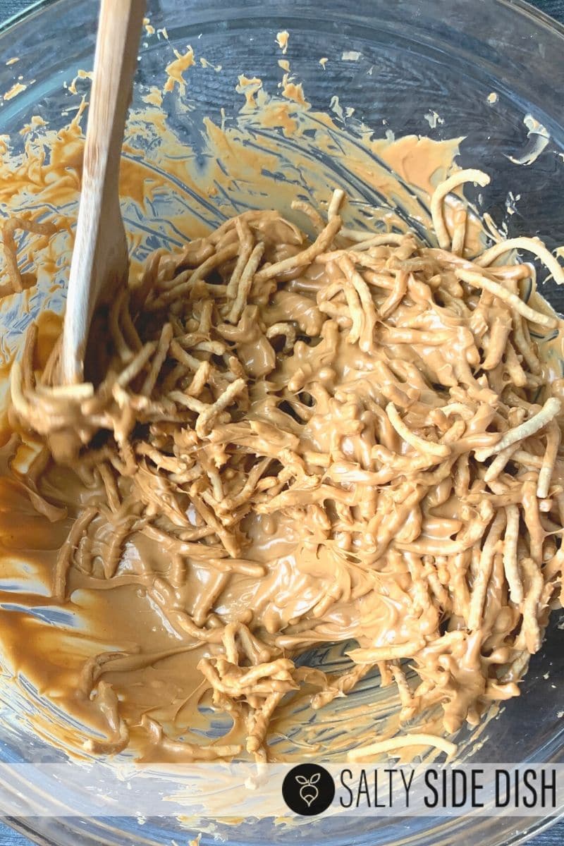melted baking chips and peanut butter stirred in a bowl