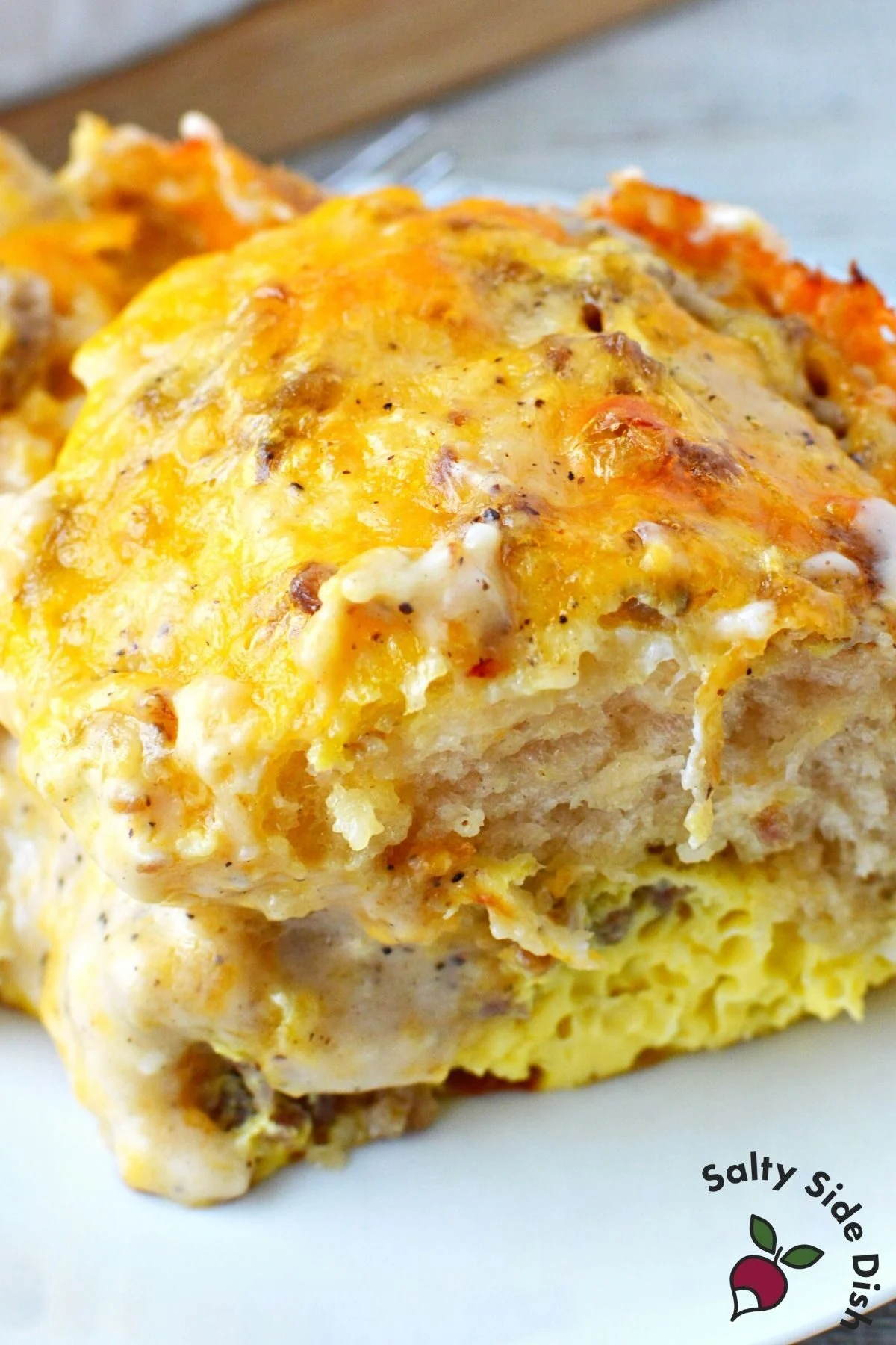 biscuits and gravy casserole on a plate ready to eat for breakfast.