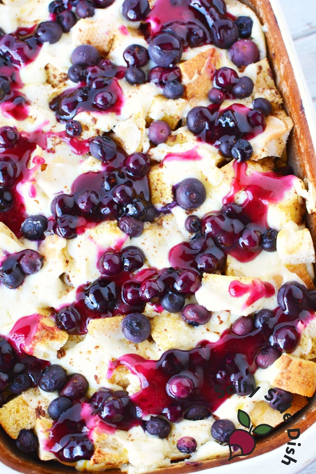 blueberry french toast casserole with blueberry sauce.