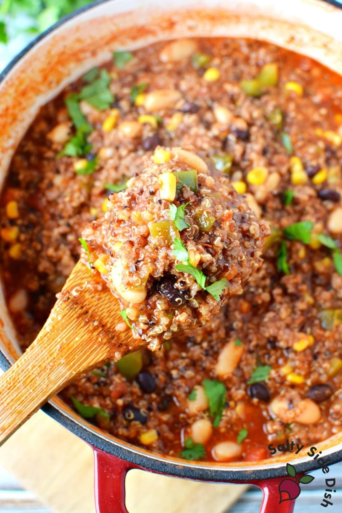 wooden spoon with chili on it.