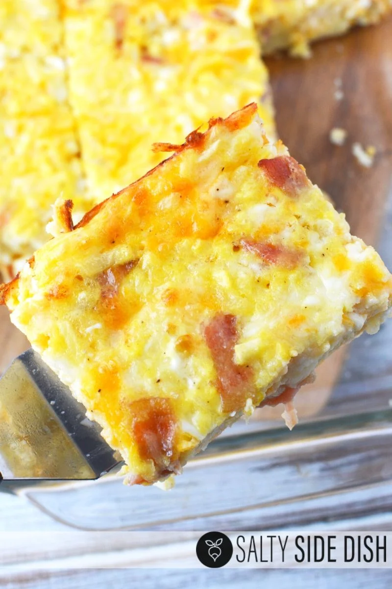 Cut slice of amish breakfast casserole, which makes 18 slices to feed an office, potluck, or holiday morning crowd