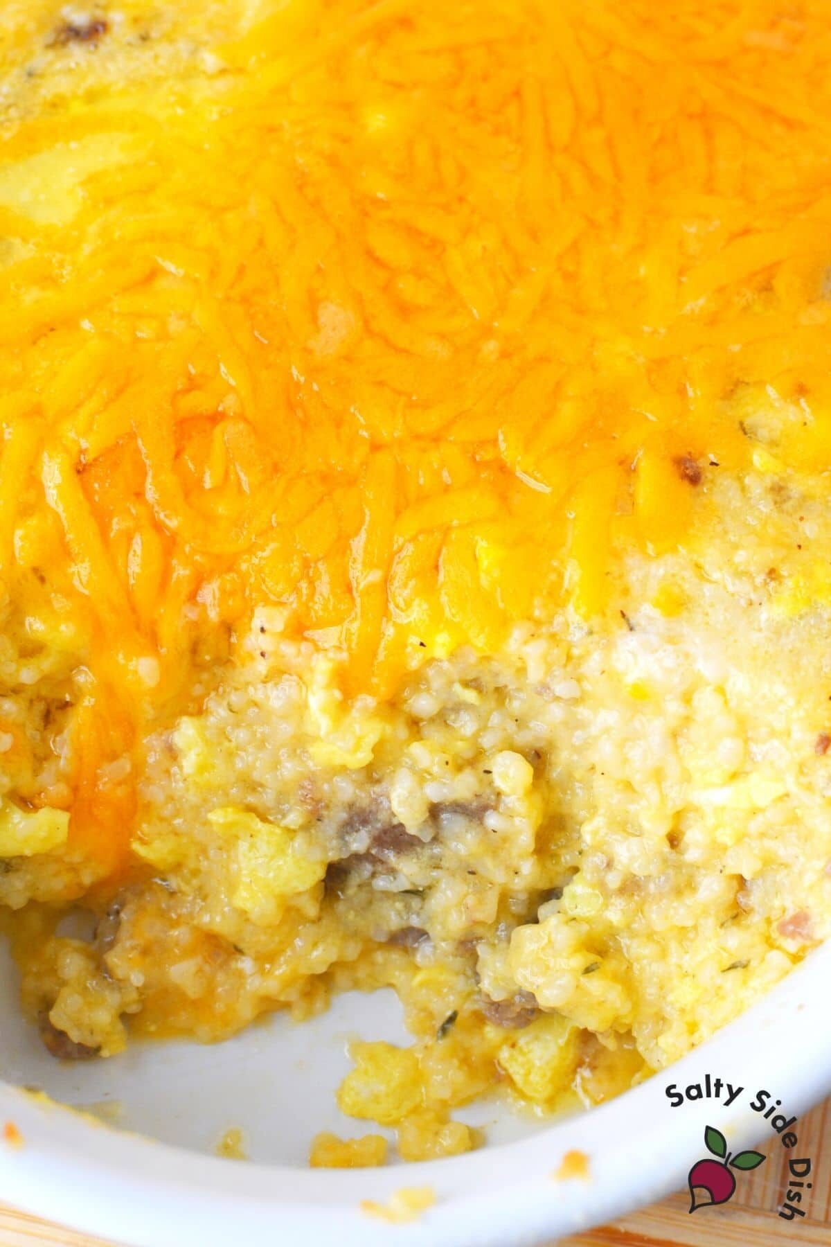 Sausage and grits casserole with cheese in a dish