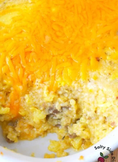Sausage and grits casserole with cheese in a dish