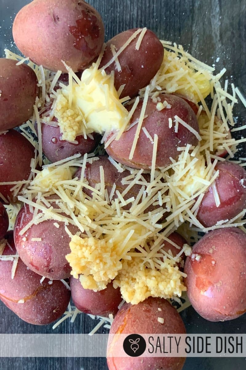 Butter, garlic, and Parmesan on whole red potatoes with skins on