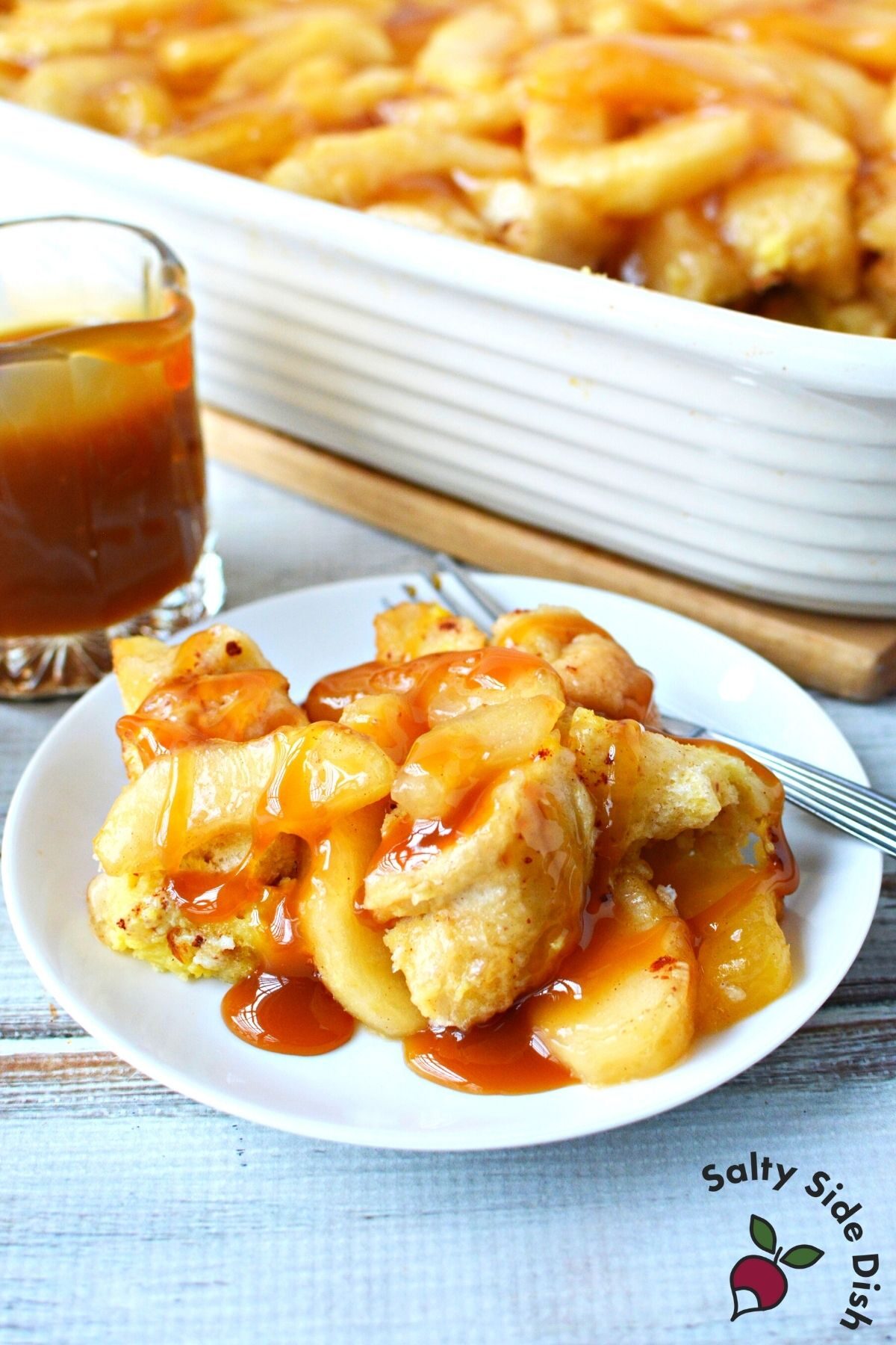 plate of apple pie breakfast bake with caramel sauce.