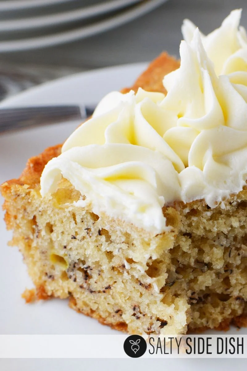 easy banana bar recipe with piles high of cream cheese frosting close up