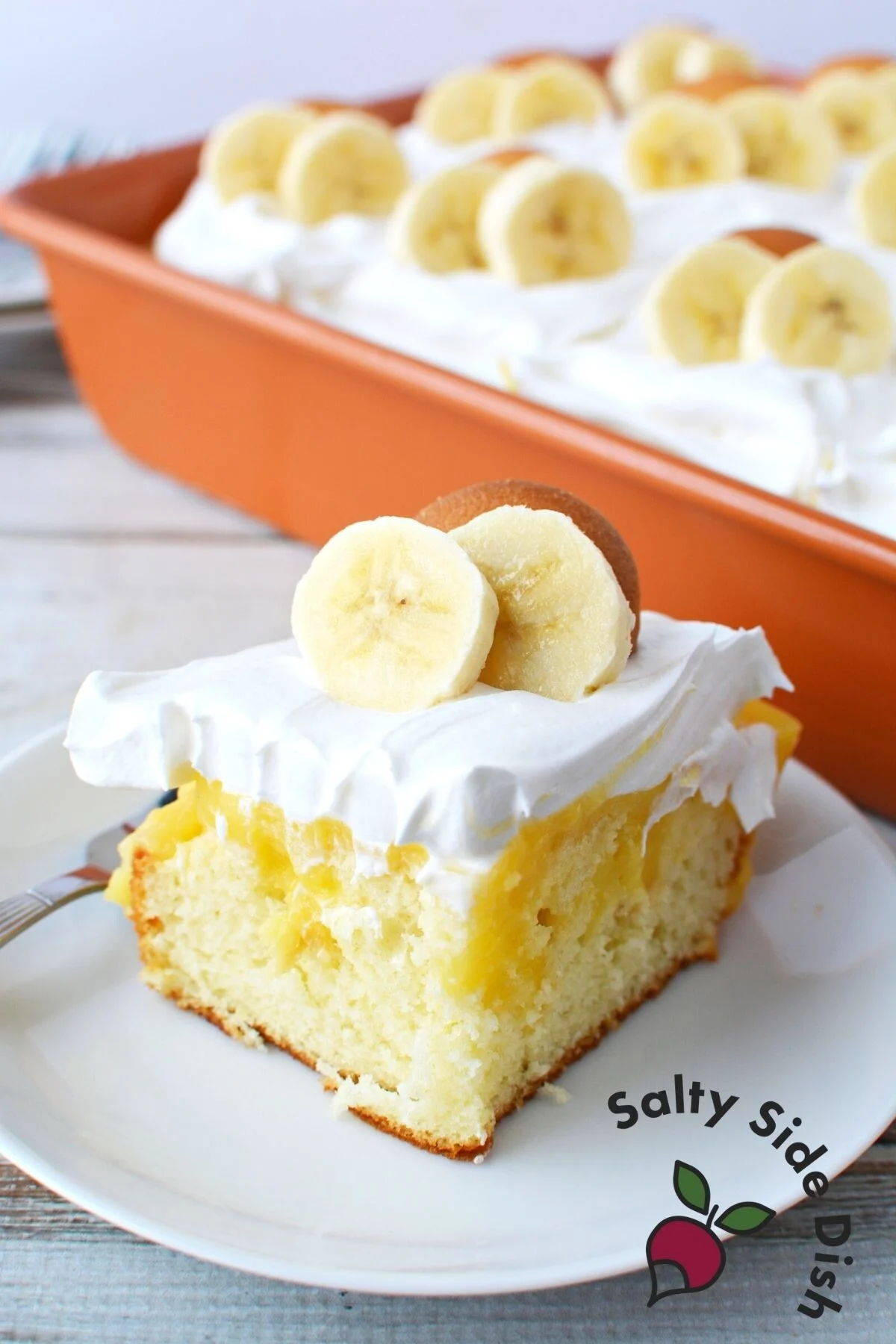 slice of banana pudding poke cake.