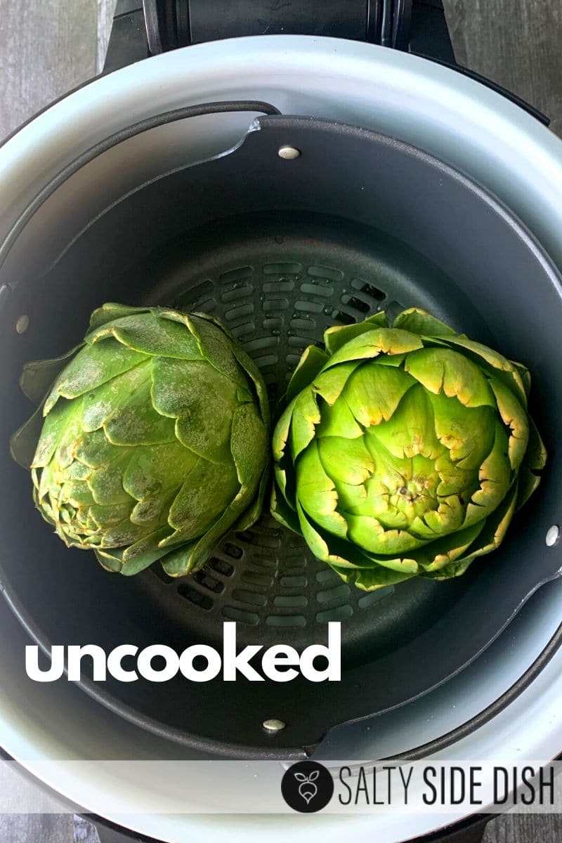 raw artichokes ready in pressure cooker basket