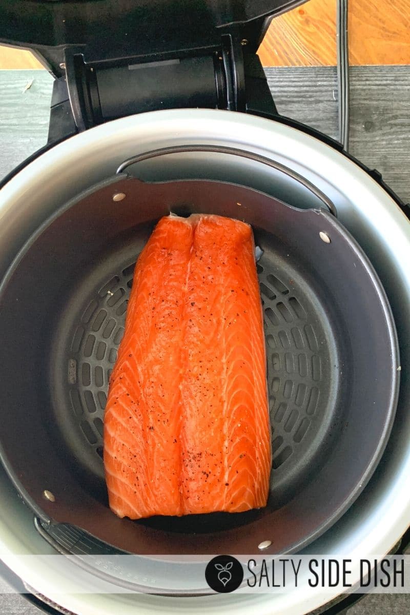lay salmon in the air crisp basket of the air fryer
