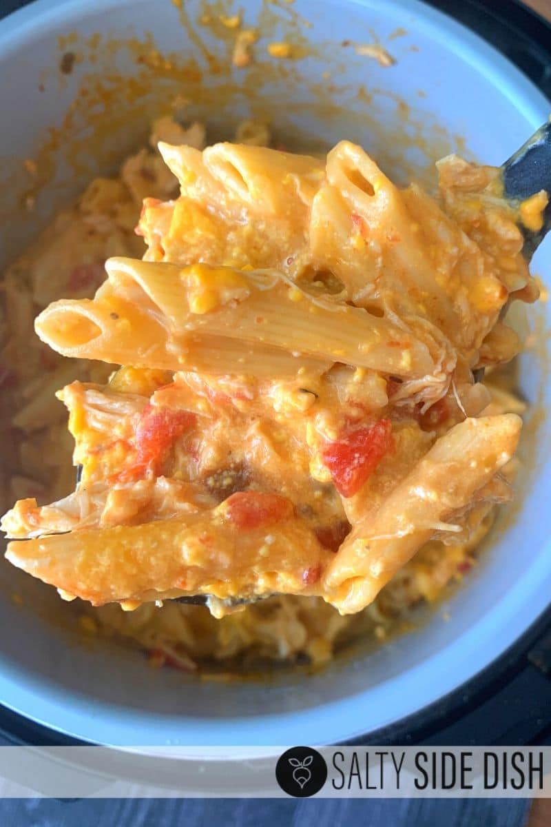 simple ultimate southern easy chicken spaghetti or penne with rotel tomatoes being served right out of the pressure cooker pot