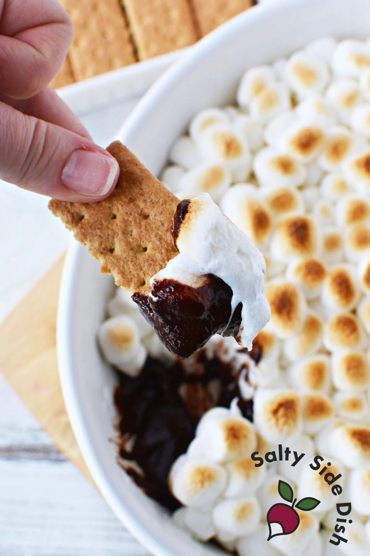 s'mores dip with chocolate and marshmallows.