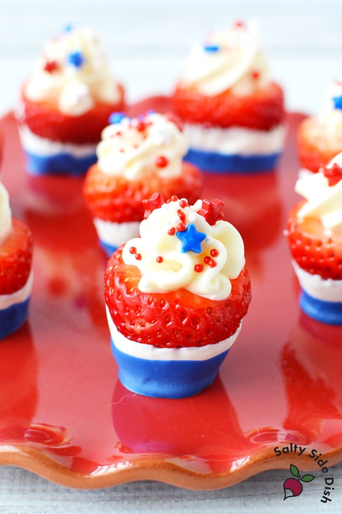 red white and blue strawberry on a red plate