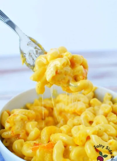 cheesy macaroni and cheese on a fork