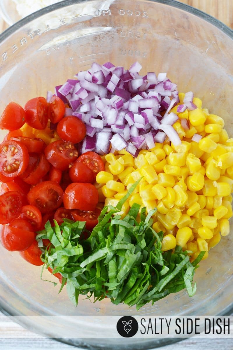 simple easy cold side salad recipe perfect for picnics with this corn and tomato salad with purple onions, fresh basil and little tomatoes
