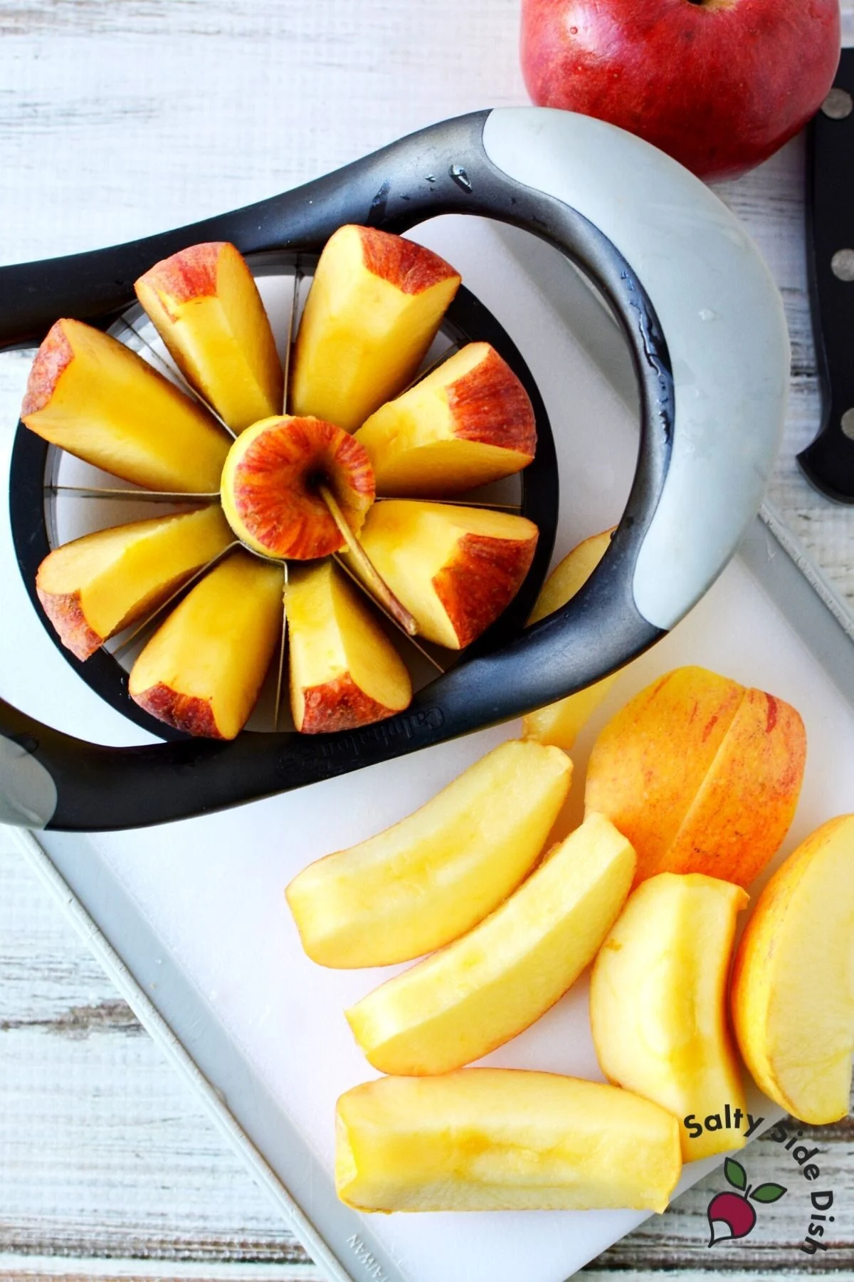 cutting an apple with an apple slicer