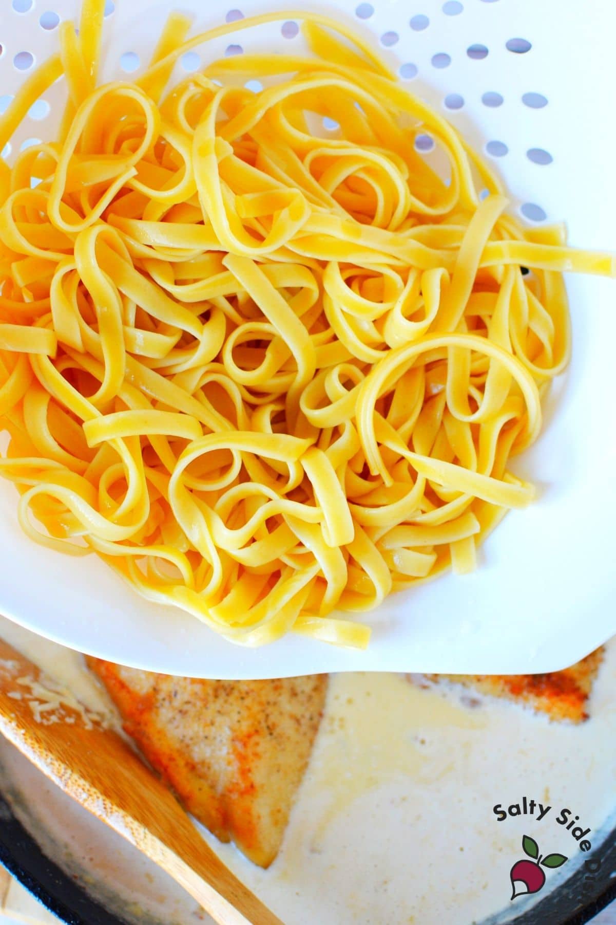 fettuccini pasta in a colander