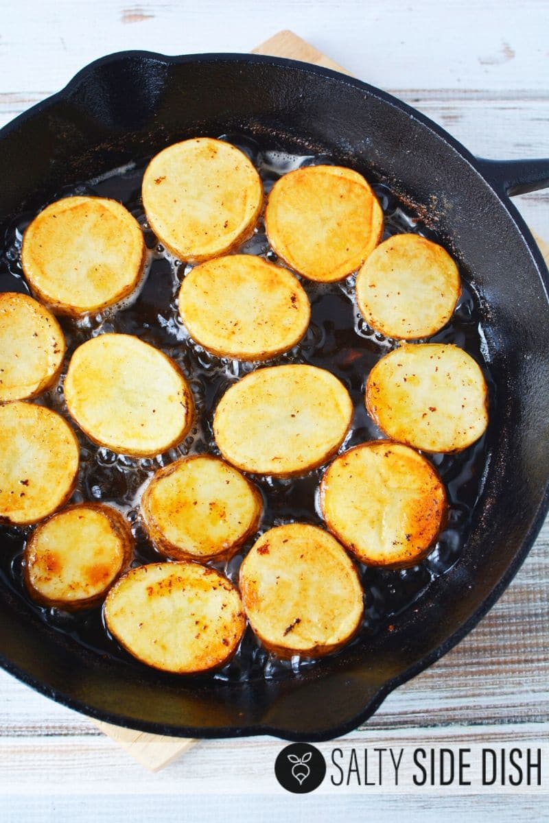 potatoes frying up in pan and ready for the oven
