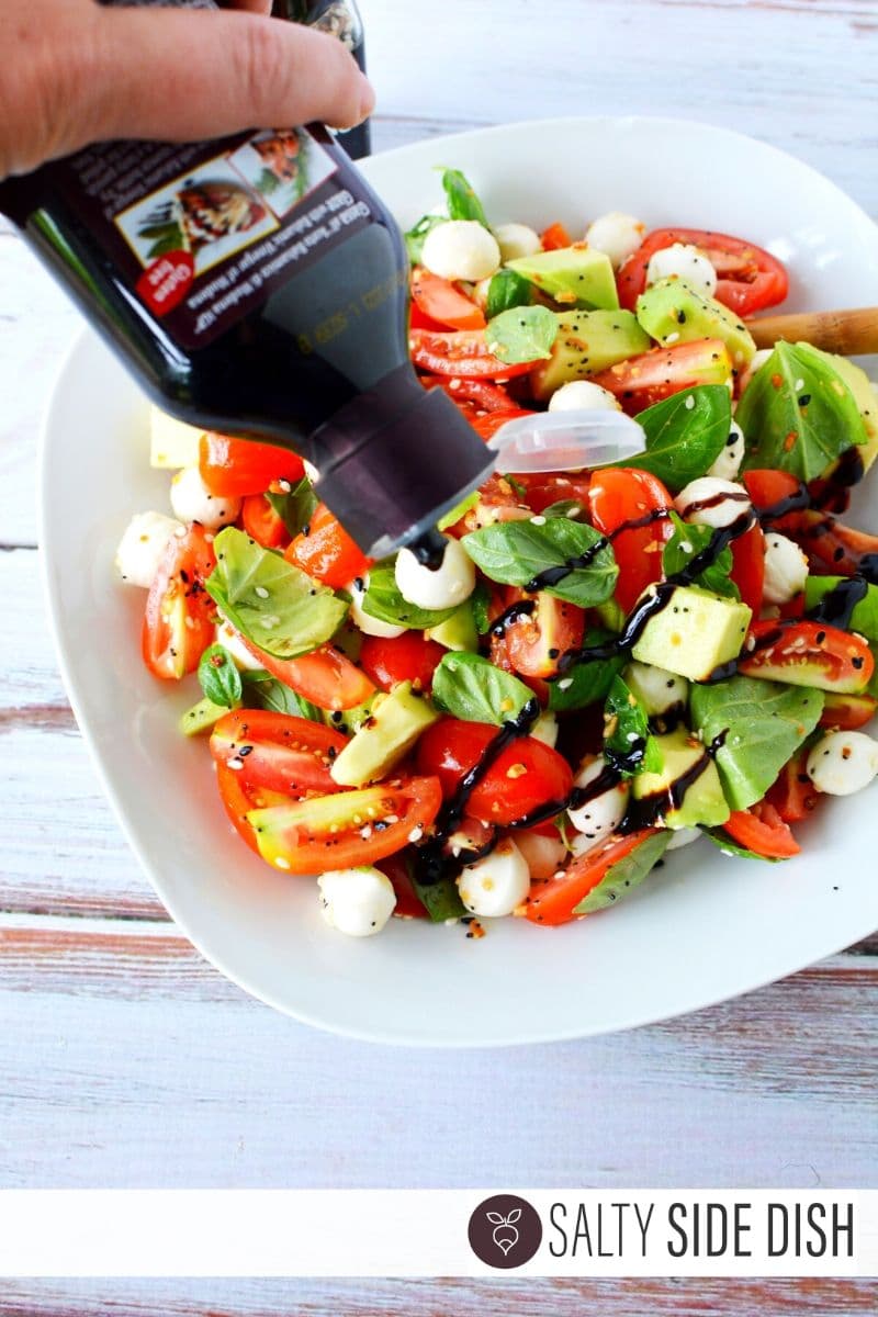 Balsamic Glaze being added to salad