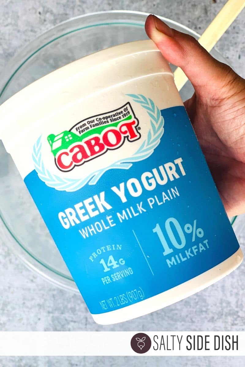 whole fat cabot greek yogurt tub being held