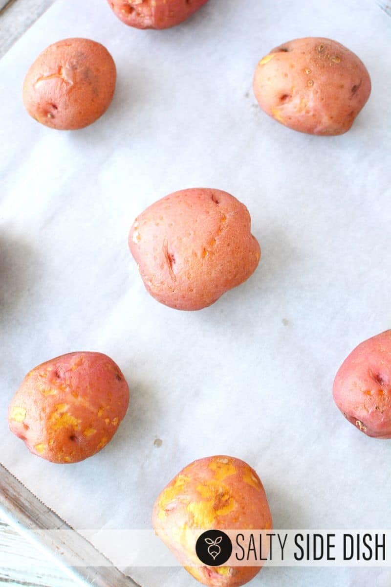 mini red potatoes on a sheet pan with parchment paper