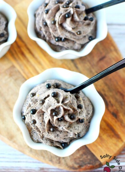 the grey stuff in a white bowl with black tasting spoons