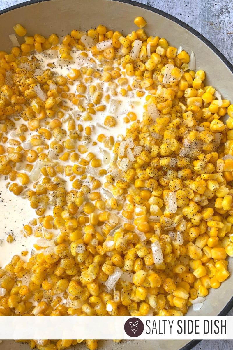 whipping cream and seasonings in cast iron pan with corn