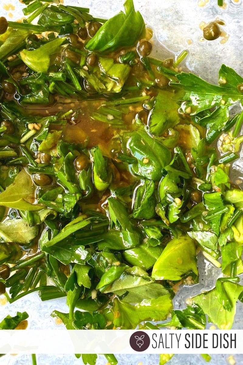 fresh herb dressing in a bowl marinating