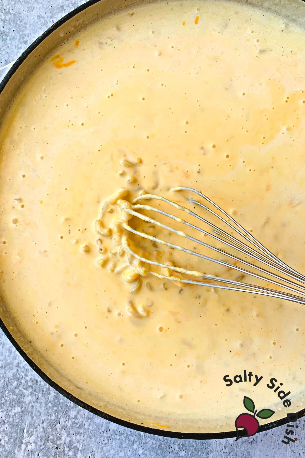 add uncooked macaroni in pan.