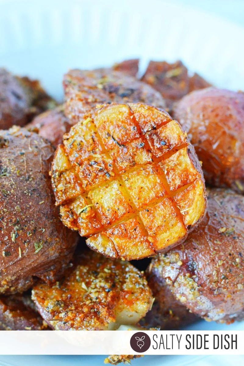Parmesan Roasted Potatoes scored and facing up to see the delicious crispy outside