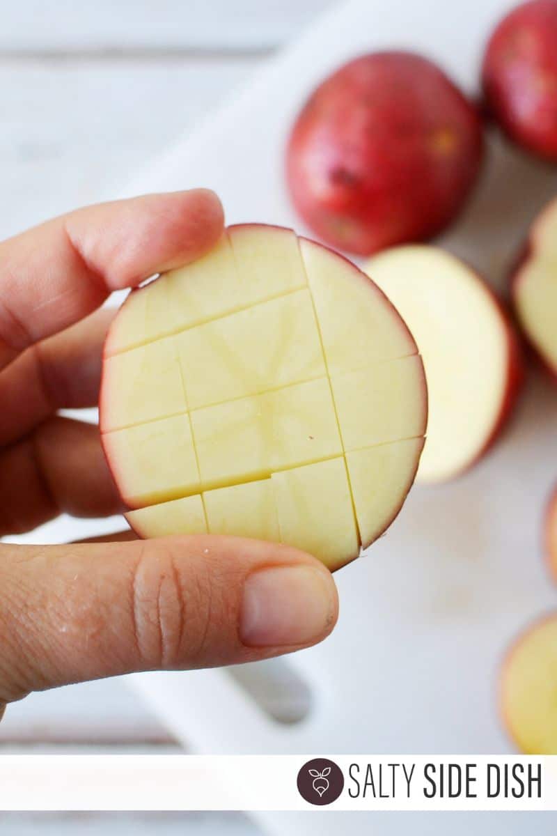 cut red potato in half and score