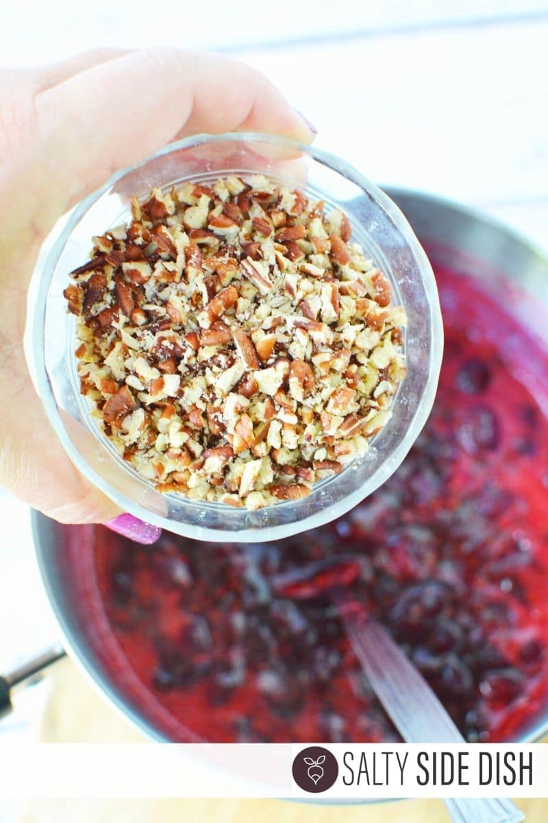 delicious pecans dumped into cranberry dip