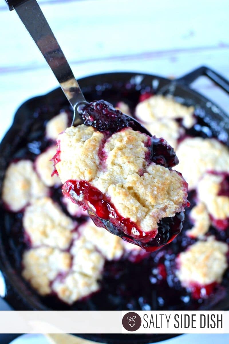 Scoop of fresh blackberry cobbler on a spoon
