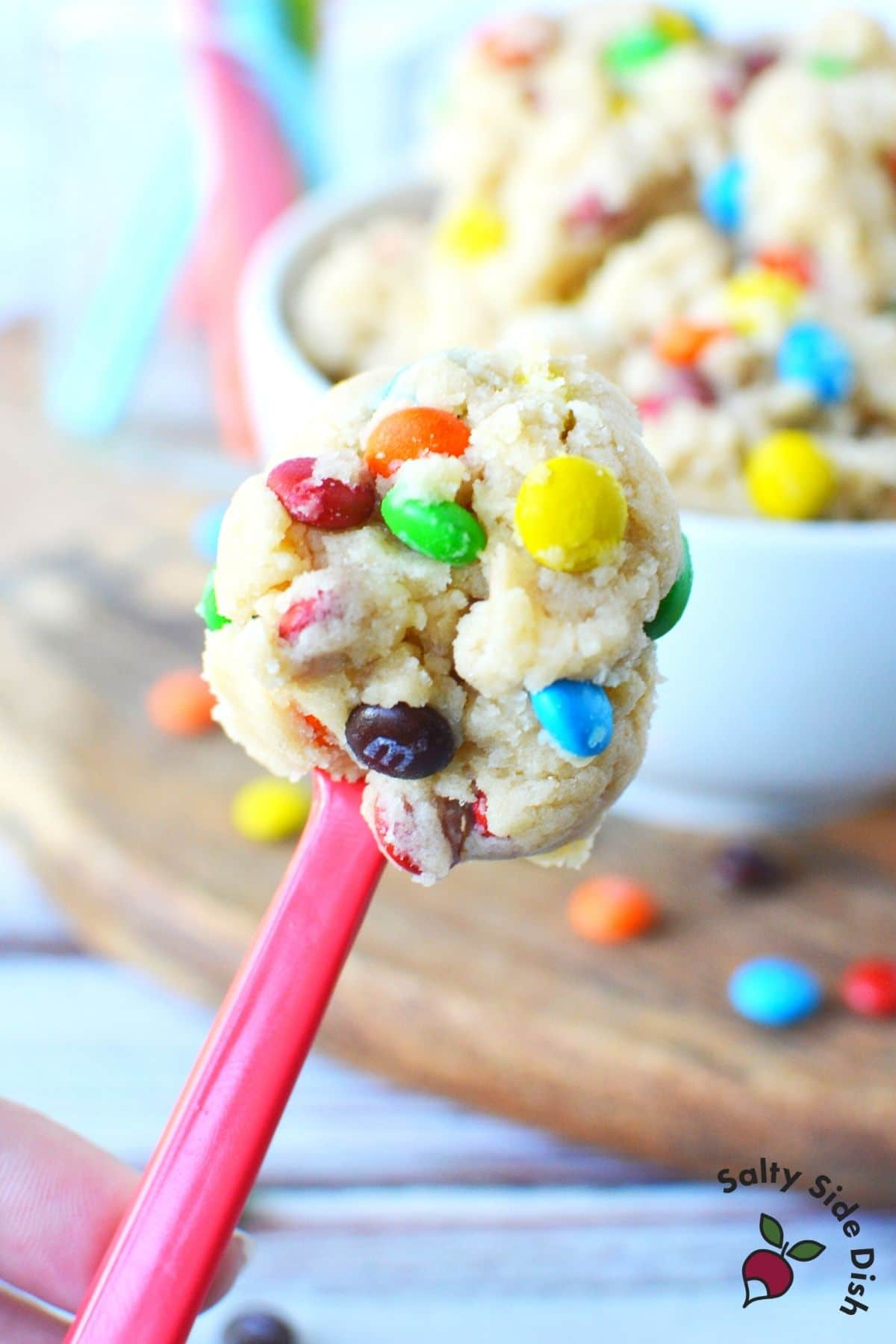 tasting spoon with edible cookie dough on it